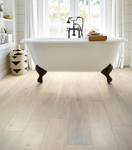 Bathroom with wood-look luxury vinyl flooring from Flooring Source in the Auburn, MA area