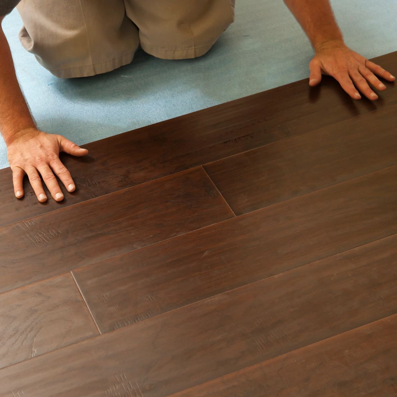 Person installing flooring from Flooring Source in the Auburn, MA area