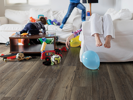 kids playing in room with wood-look laminate flooring from Flooring Source in the Auburn, MA area