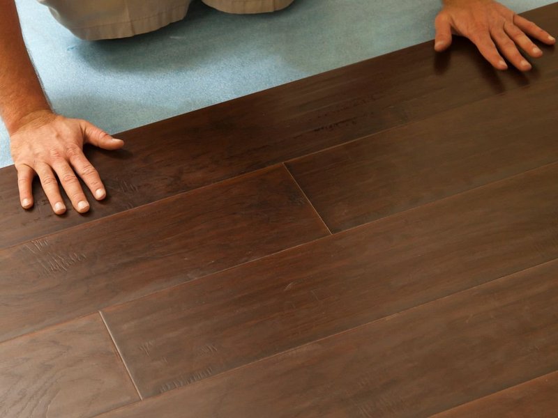 Person installing flooring from Flooring Source in the Auburn, MA area